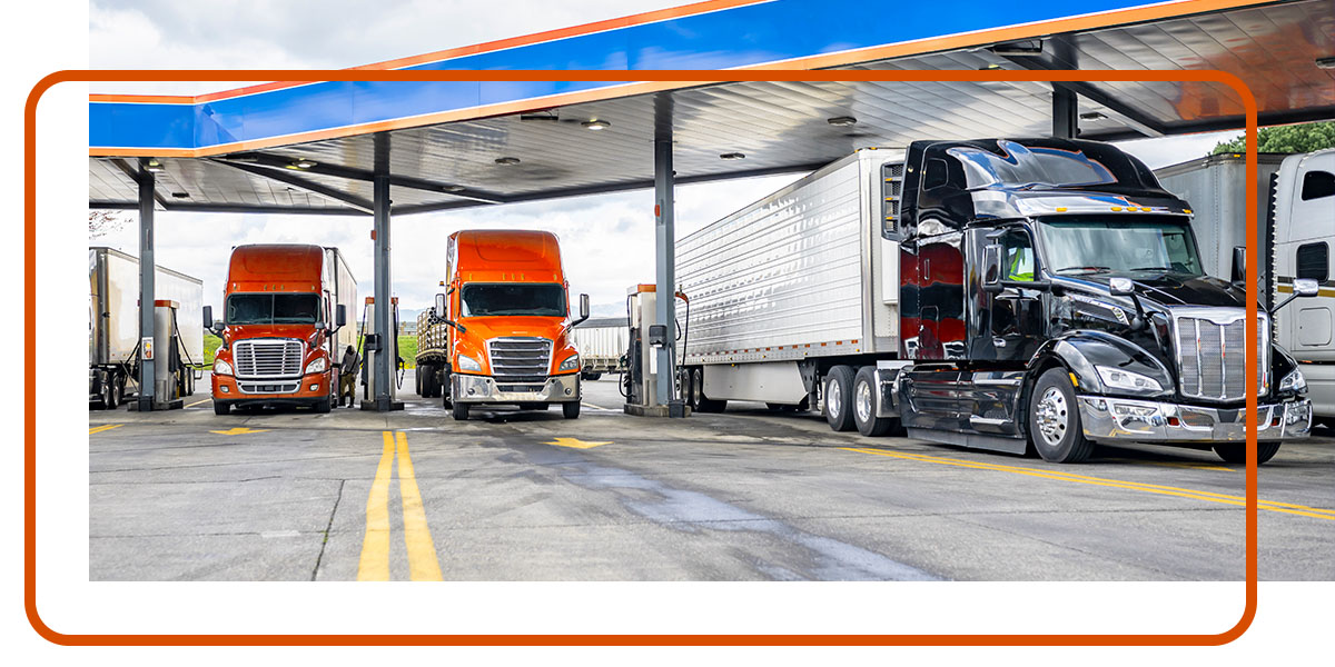 freight trucks at a gas station